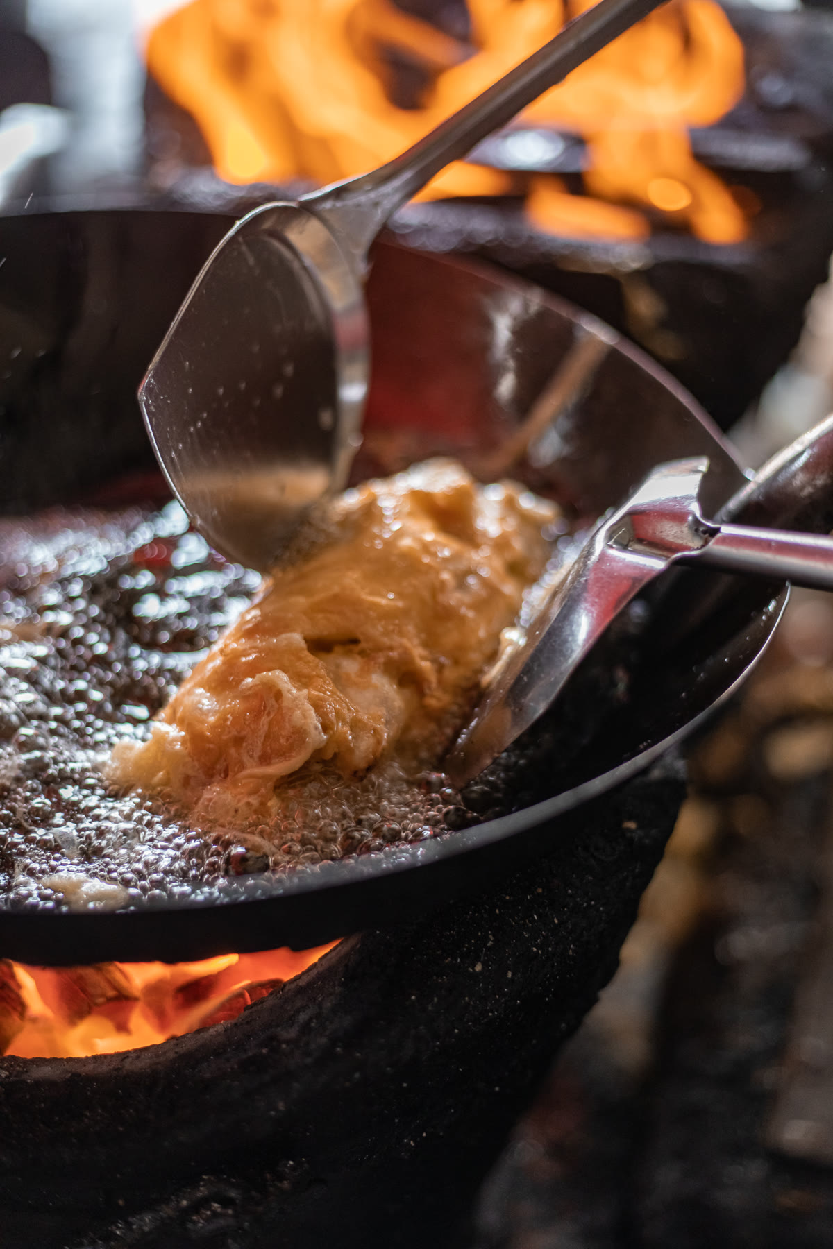 Crab omelette frying in the wok
