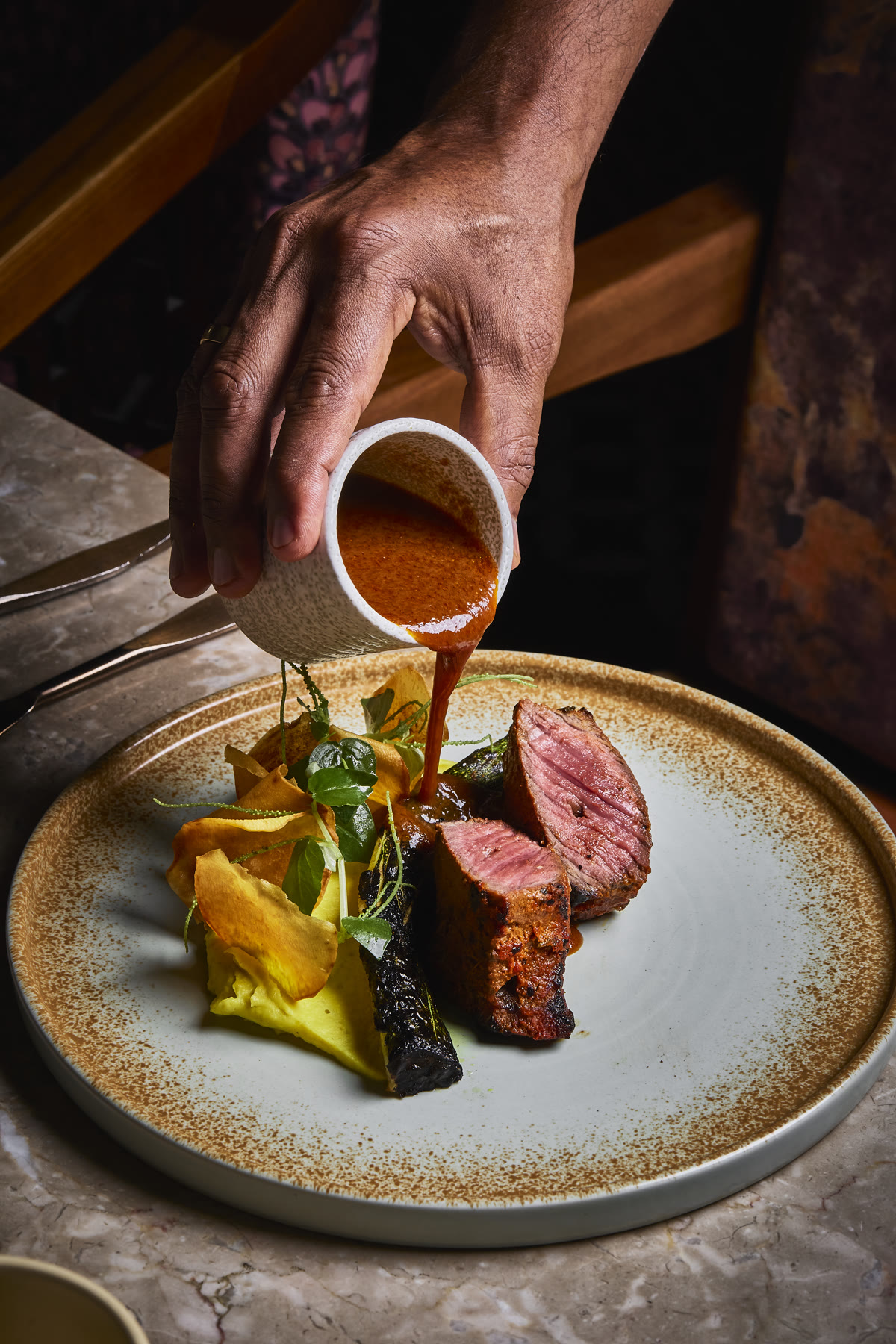 Sauce poured over lamb